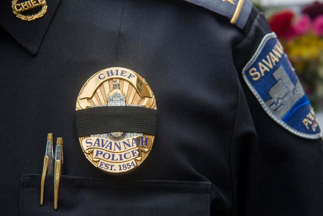 Police Chief Roy Minter wears a black band over his badge at a memorial ceremony on Monday, May 13, 2019, honoring slain Savannah police Sgt. Kelvin Ansari.