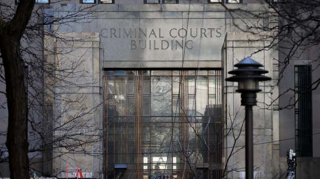 A person walks inside the Manhattan Criminal Court in New York City, U.S., March 29, 2023. Manhattan District Attorney Alvin Bragg's office is investigating $130,000 paid in the final weeks of former U.S. President Donald Trump's 2016 election campaign to Stormy Daniels, a porn star who said she had a sexual encounter with Trump in 2006 when he was married to his current wife Melania.