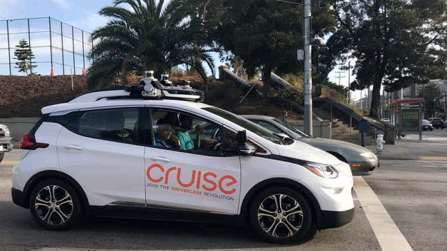 A Cruise robotaxi sits in a parking lot in San Francisco.