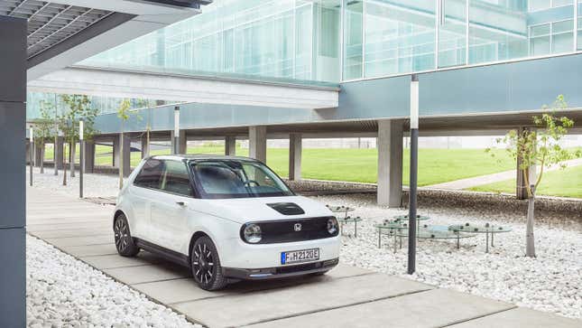 A white Honda E electric car. 