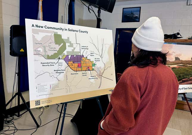 FILE - A map of a new proposed community in Solano County, Calif., is displayed during a news conference in Rio Vista, Calif. on Jan. 17, 2024. A billionaire-backed proposal to build an eco-friendly California city from scratch is off to a bumpy start in qualifying its voter initiative for the Nov. 5 ballot. The deadline for the Solano County counsel&#39;s office to give California Forever the ballot title they need to start gathering signatures is Thursday, Feb. 29. (AP Photo/Janie Har, File)