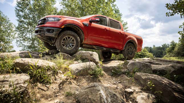 A red Ford Ranger pickup truck. 