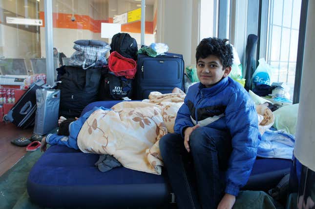Image for article titled Photos: A family of Kurdish refugees is living in a Moscow airport lounge