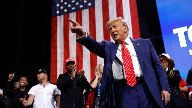 Republican presidential nominee, former U.S. President Donald Trump points to the crowd after delivering remarks during a campaign rally at the Cobb Energy Performing Arts Centre on October 15, 2024 in Atlanta, Georgia. With early voting starting today in Georgia both Trump and Democratic presidential nominee, Vice President Kamala Harris are campaigning in the Atlanta region this week as polls show a tight race.