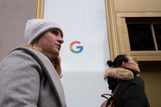 Women walk past Google offices, Monday, Dec. 17, 2018, in New York.
