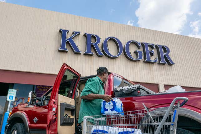 A customer loads his truck after shopping at a Kroger grocery store in Houston, Texas. 