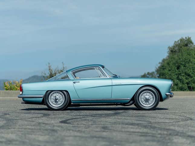 Side view of a teal Aston Martin DB2/4 by Bertone
