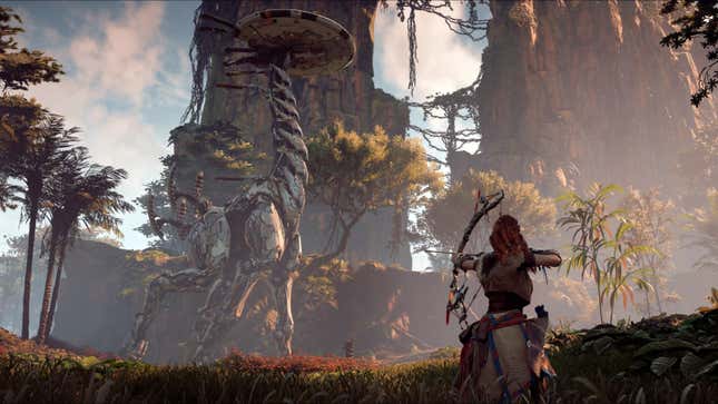 An image from Horizon Zero Dawn depicting protagonist Aloy aiming an arrow at a massive walking creature.