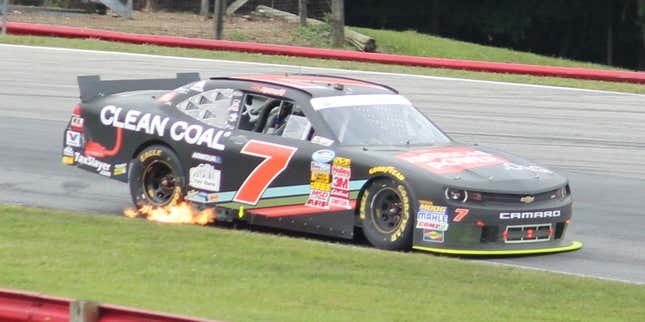 a nascar spitting flames out its sidepipes