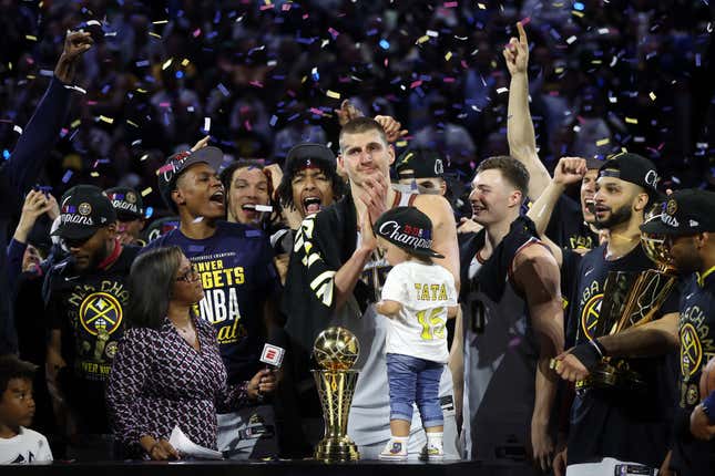 DENVER, COLORADO - JUNE 12: Nikola Jokic #15 of the Denver Nuggets celebrates the Bill Russell Award for NBA Finals Most Valuable Player after their 94-89 win over the Miami Heat in Game 5 of the 2023 NBA Finals to win the NBA Championship in Ball Arena on June 12, 2023 in Denver, Colorado.  NOTE TO USER: User expressly acknowledges and agrees that by downloading or using this image, user agrees to the terms and conditions of the Getty Images License Agreement.  (Photo by Matthew Stockman/Getty Images)