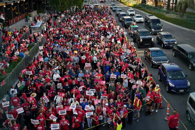 FILE - Members of the Culinary Workers Union rally along the Las Vegas Strip, Thursday, Aug. 10, 2023, in Las Vegas. After a marathon week of negotiations, the Las Vegas hotel workers union says it has reached a tentative deal with Wynn Resorts. It was the last contract the Culinary Workers Union needed to avoid a strike Friday, Nov. 10, 2023, and came after the union&#39;s tentative deals with Caesars Entertainment and MGM Resorts. (AP Photo/John Locher, File)