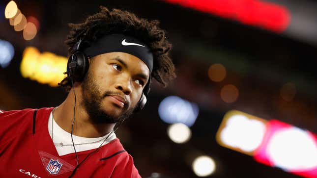 Arizona Cardinals quarterback Kyler Murray is seen standing against the lights of an NFL stadium.