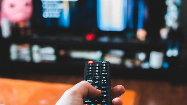 A tv remote pointing at a screen