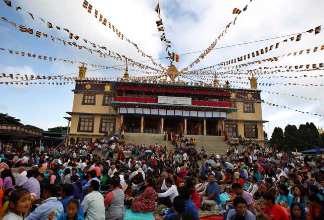 Tibetans living in exile listen to their spiritual leader the Dalai Lama.