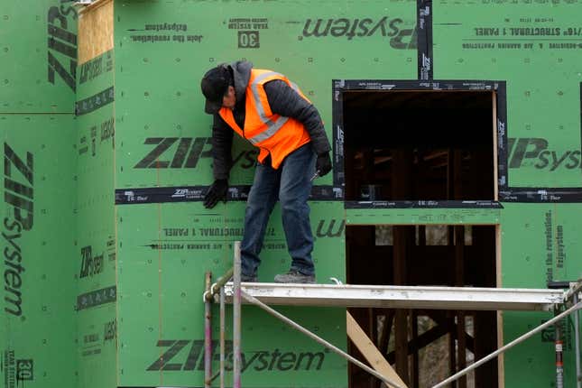 A workman secures sheathing at a residential construction site in Mount Prospect, Ill., Monday, March 18, 2024. On Tuesday, April 2, 2024, the Labor Department reports on job openings and labor turnover for February. (AP Photo/Nam Y. Huh)