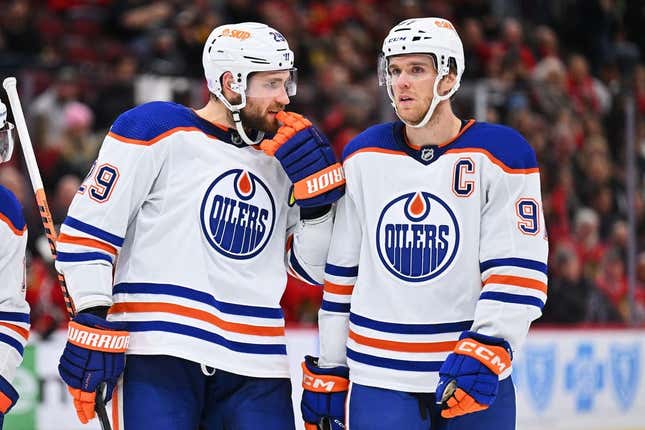 Nov 30, 2022; Chicago, Illinois, USA;  Edmonton Oilers forward Leon Draisaitl (29) and forward Connor McDavid (97) talk before a face off against the Chicago Blackhawks at United Center.