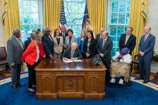 President Joe Biden is joined by Vice President Kamala Harris, Secretary of Interior Deb Haaland, Senator Tom Carper (D-DE), Senator Chris Coons (D-DE), House Majority Whip Jim Clyburn (D-SC), Rep. Lisa Blunt Rochester (D-DE), Rep. Eleanor Holmes Norton (D-DC), Delaware Supreme Court Justice CJ Seitz, Jr. and others as he signs the Brown v. Board of Education National Historical Park Expansion and Redesignation Act. 