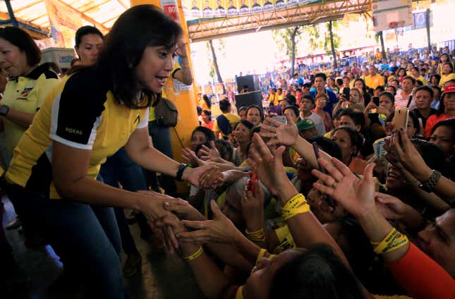 Philippine Vice-presidential candidate and congresswoman Leni Robredo is greeted by supporters during her campaign rally in Quezon City, Metro Manila, Phillipines May 4, 2016.