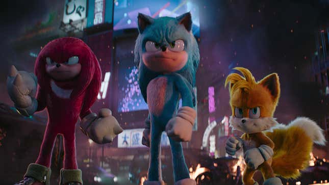 Sonic, Tails, and Knuckles stand in a burning Tokyo.