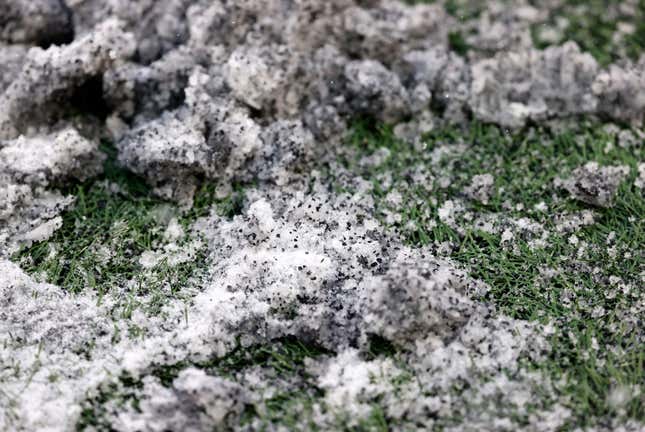 Rubber pellets from the artificial turf gave the illusion of dirty snow during a game between the New England Patriots and the New York Jets on Jan. 7, 2024, at Gillette Stadium
