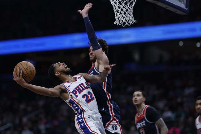 Undermanned 76ers fend off Wizards, snap skid