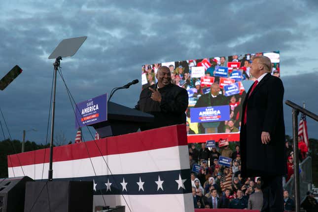 SELMA, NC - APRIL 09: Lt. Gov. Mark Robinson joins the stage with former U.S. President Donald Trump during a rally at The Farm at 95 on April 9, 2022 in Selma, North Carolina. The rally comes about five weeks before North Carolinas primary elections where Trump has thrown his support behind candidates in some key Republican races.