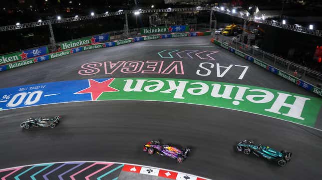 George Russell of Great Britain and Mercedes Max Verstappen of the Netherlands and Oracle Red Bull Racing and Fernando Alonso of Spain and Aston Martin F1 Team drive on track during the F1 Grand Prix of Las Vegas at Las Vegas Strip Circuit on November 18, 2023 in Las Vegas, Nevada