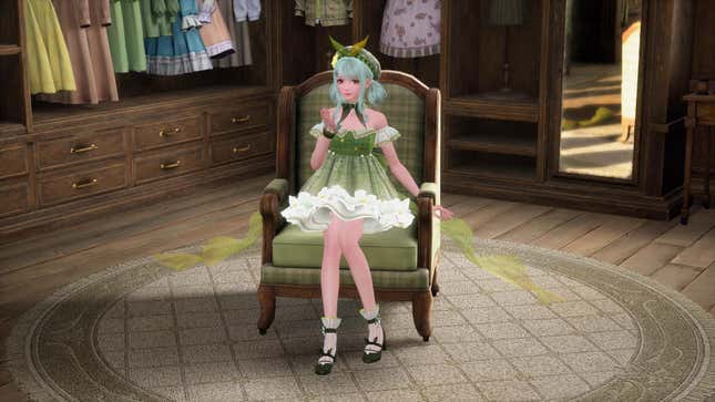 Nikki sits on a chair in a green costume and green hair.