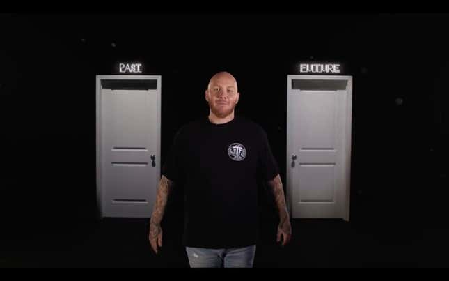 Tim TimTheTatman Betar stands between two white doors against a black background