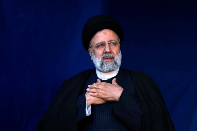 FILE- Iranian President Ebrahim Raisi places his hands on his heart as a gesture of respect to the crowd during the funeral ceremony of the victims of Wednesday&#39;s bomb explosion in the city of Kerman about 510 miles (820 kms) southeast of the capital Tehran, Iran, Jan. 5, 2024. Raisi arrived in Sri Lanka on Wednesday to inaugurate a hydro-power irrigation scheme that had long been delayed due to international sanctions. (AP Photo/Vahid Salemi, File)