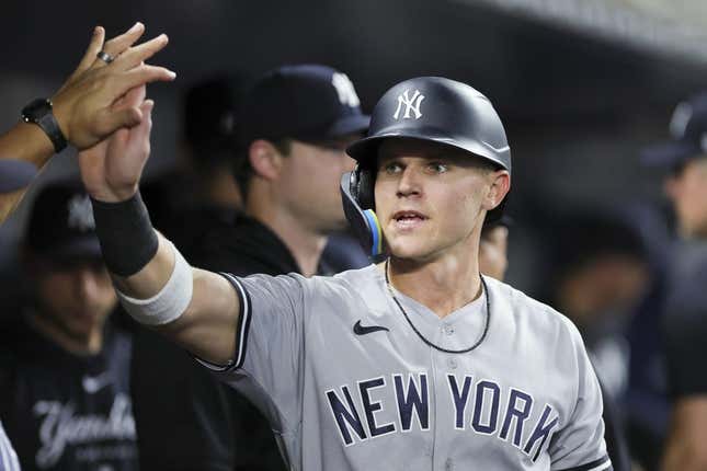 Aug 11, 2023; Miami, Florida, USA; New York Yankees first baseman Jake Bauers (61) celebrates after scoring against the Miami Marlins during the fourth inning at loanDepot Park.