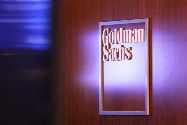 Goldman Sachs logo on a wooden wall panel