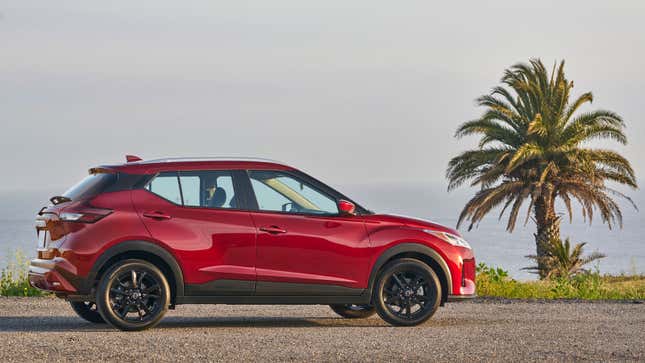 A photo of a red Nissan Kicks SUV