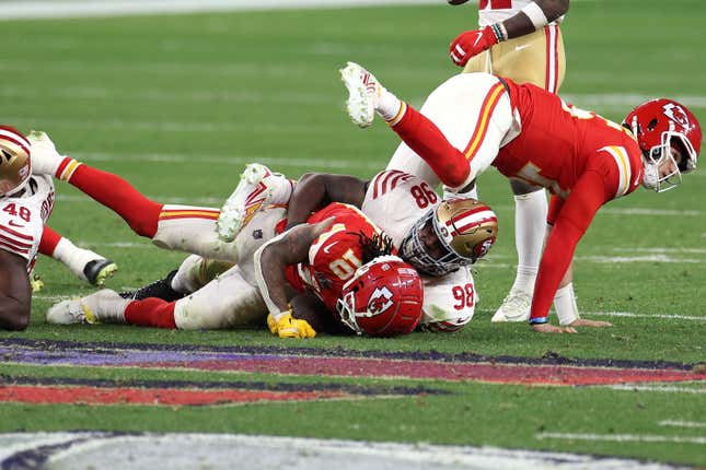LAS VEGAS, NEVADA - FEBRUARY 11: Isiah Pacheco #10 of the Kansas City Chiefs is tackled by Javon Hargrave #98 of the San Francisco 49ers in overtime during Super Bowl LVIII at Allegiant Stadium on February 11, 2024 in Las Vegas, Nevada. (Photo by Harry How/Getty Images)
