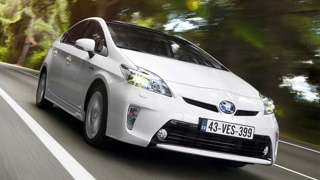 A white Toyota Prius on a highway 