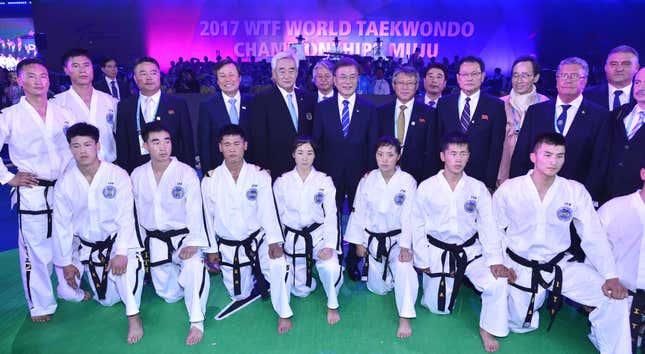 South Korean President Moon Jae-in (C) poses with a North Korean taekwondo team while attending the opening ceremony of the World Taekwondo Federation's World Taekwondo Championships in Muju, some 240km south of Seoul, South Korea, 24 June 2017. The North Korean squad participated in the seven-day event to demonstrate during its opening and closing ceremonies.