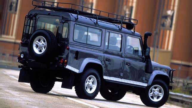 A photo of a dark blue Land Rover Defender. 