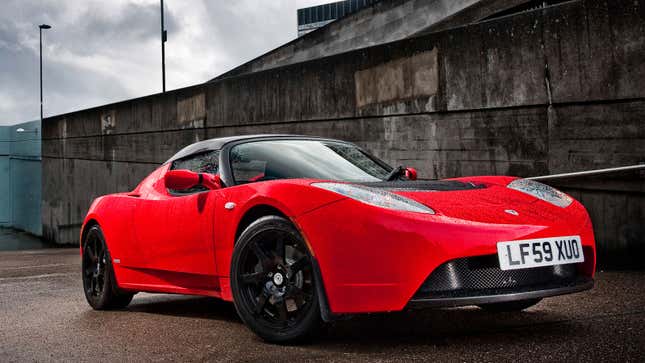 A photo of a red Tesla Roadster electric car. 