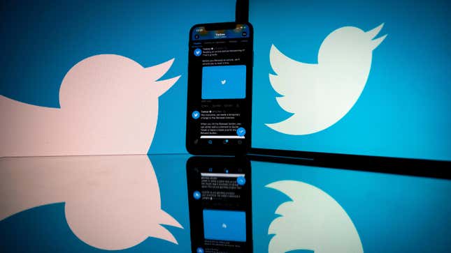 The Twitter logo displayed on a phone.