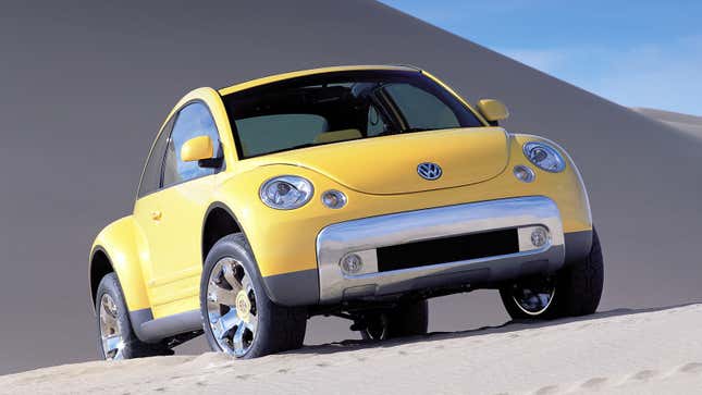 Volkswagen press image of the yellow 2000 Beetle Dune Concept, seen from a front-quarter angle and posed in the desert.