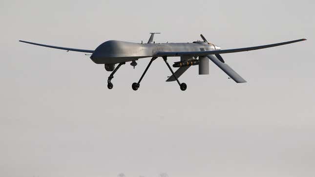 File photo of a U.S. Air Force MQ-1B Predator unmanned aerial vehicle (UAV), carrying a  Hellfire missile landing at a secret air base after flying a mission in  the Persian Gulf region on January 7, 2016.