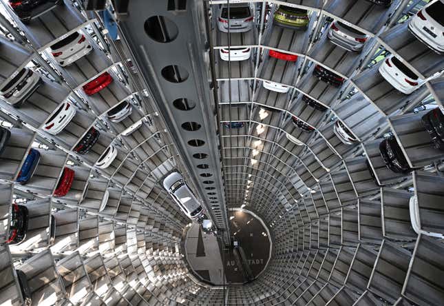 Volkswagen cars stand on elevator platforms inside one of the twin towers used as storage at the Autostadt promotional facility next to the Volkswagen factory in Wolfsburg, Germany. 