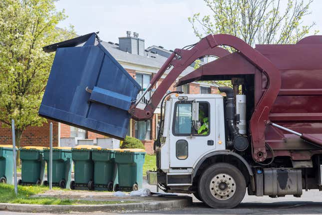 Red truck with a loading household container home maintenance public services on the street