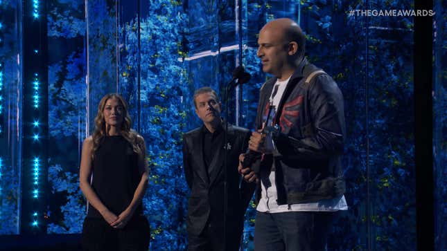 Amir Satvat gives his speech while TGAs' hosts watch from the sidelines.