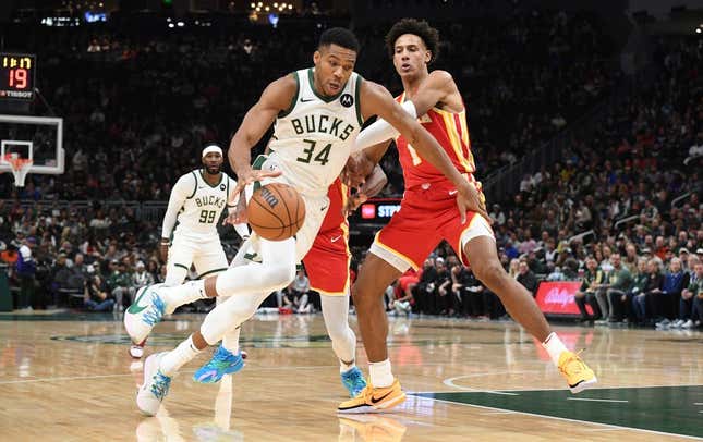 Oct 29, 2023; Milwaukee, Wisconsin, USA; Milwaukee Bucks forward Giannis Antetokounmpo (34) drives to the basket against Atlanta Hawks forward Jalen Johnson (1) in the first half at Fiserv Forum.