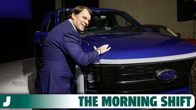     Ford CEO Jim Farley pats a Ford F-150 Lightning truck before announcing at a news conference that Ford Motor Company will partner with the world's largest battery maker, a China-based company called Contemporary Amperex Technology, to create an electric vehicle battery plant in Marshall, Michigan, on February 13, 2023 in Romulus, Michigan.