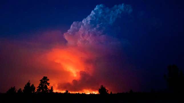 The Bootleg Fire sends a cloud climbing into the sky.