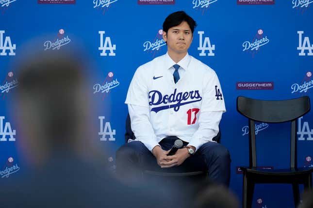 Los Angeles Dodgers&#39; Shohei Ohtani listens to questions during a baseball news conference at Dodger Stadium Thursday, Dec. 14, 2023, in Los Angeles. (AP Photo/Ashley Landis)