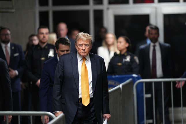 : Former U.S. President Donald Trump walks to speak to the media during his trial for allegedly covering up hush money payments at Manhattan Criminal Court on May 21, 2024 in New York City. 