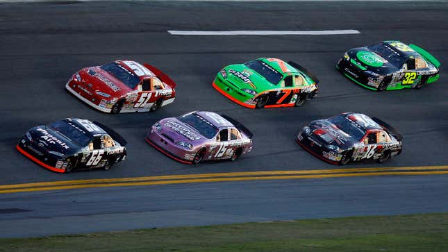 A photo of stock cars racing round Daytona. 